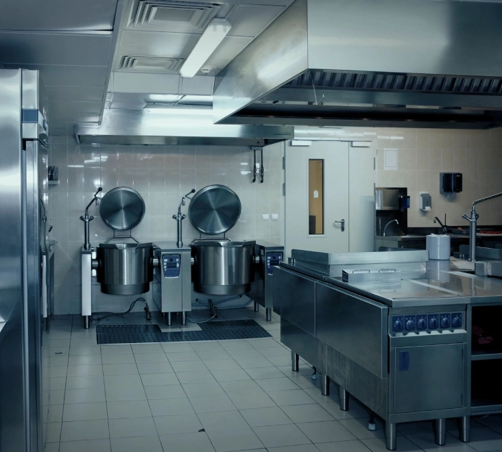 A kitchen with two large stainless steel appliances.