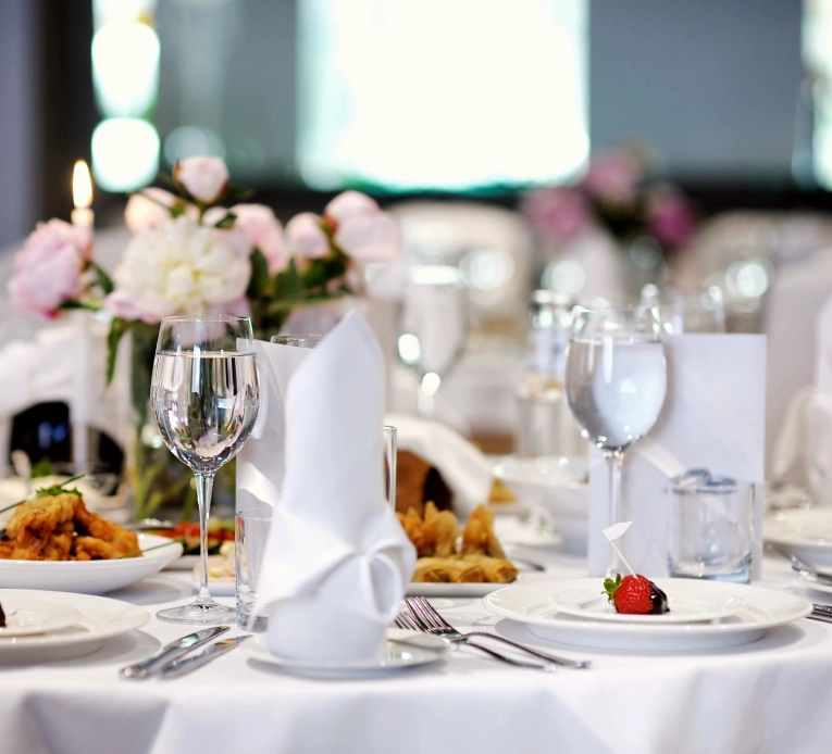 A table set with plates and silverware on it.